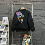 Stussy black bomber jacket, back graphic patches and ribbed hem cuffs