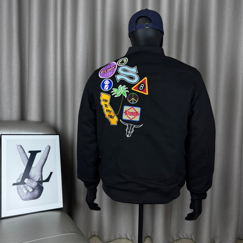 Black Stussy bomber jacket, back graphic patches and multicolor logos