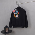 Stussy black bomber jacket, back graphic patch cluster and ribbed cuffs