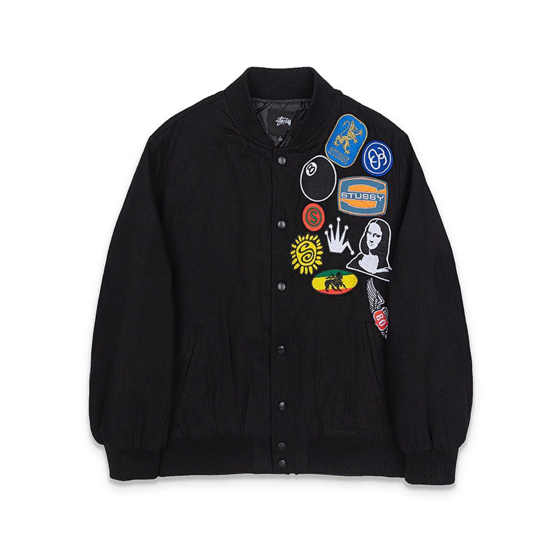 Black button-front jacket with colorful stitched patches on chest