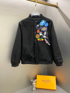 Black Stussy bomber jacket with chest patch graphics and button-front closure