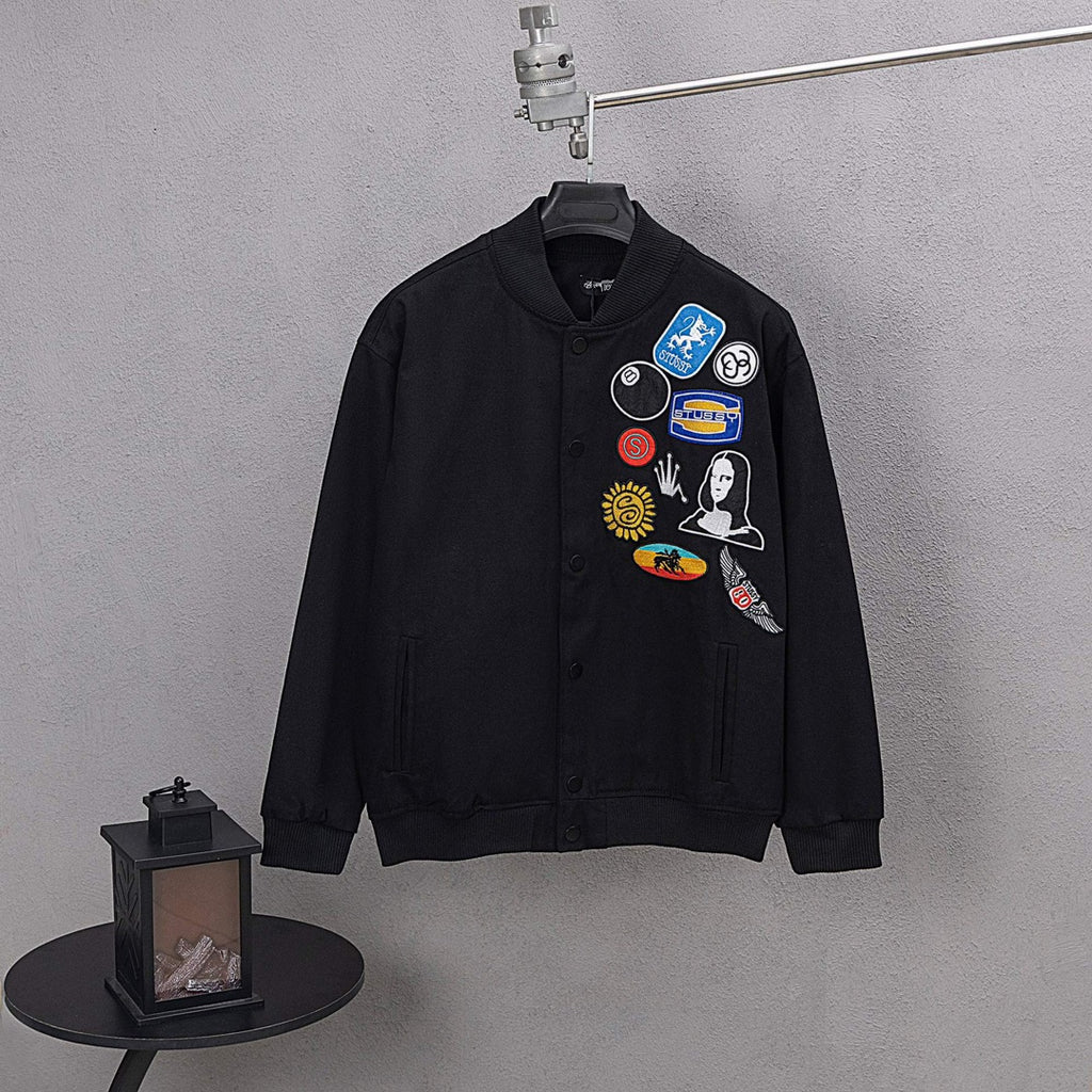 Stussy black bomber jacket, chest patch graphics on button-front
