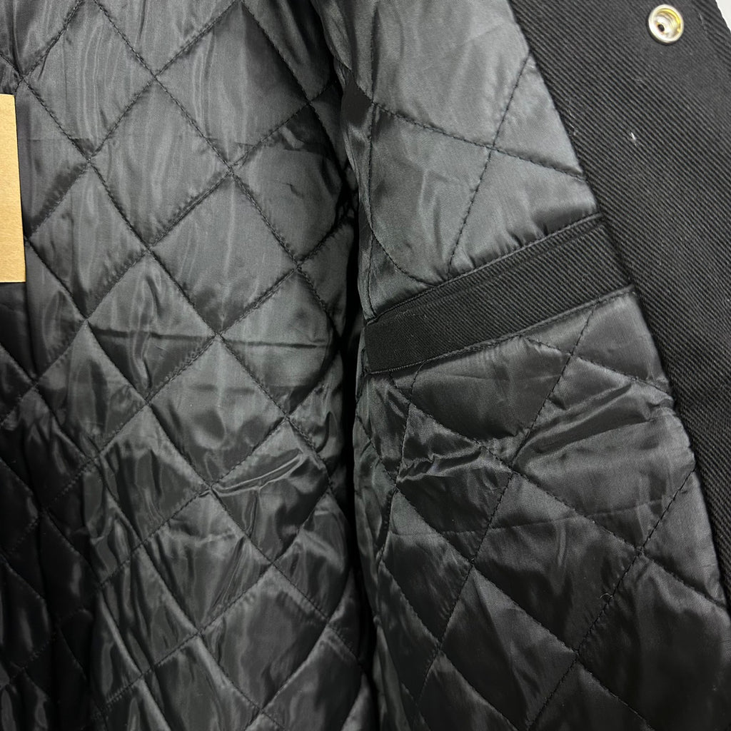 Black quilted bomber jacket lining with diamond stitching detail