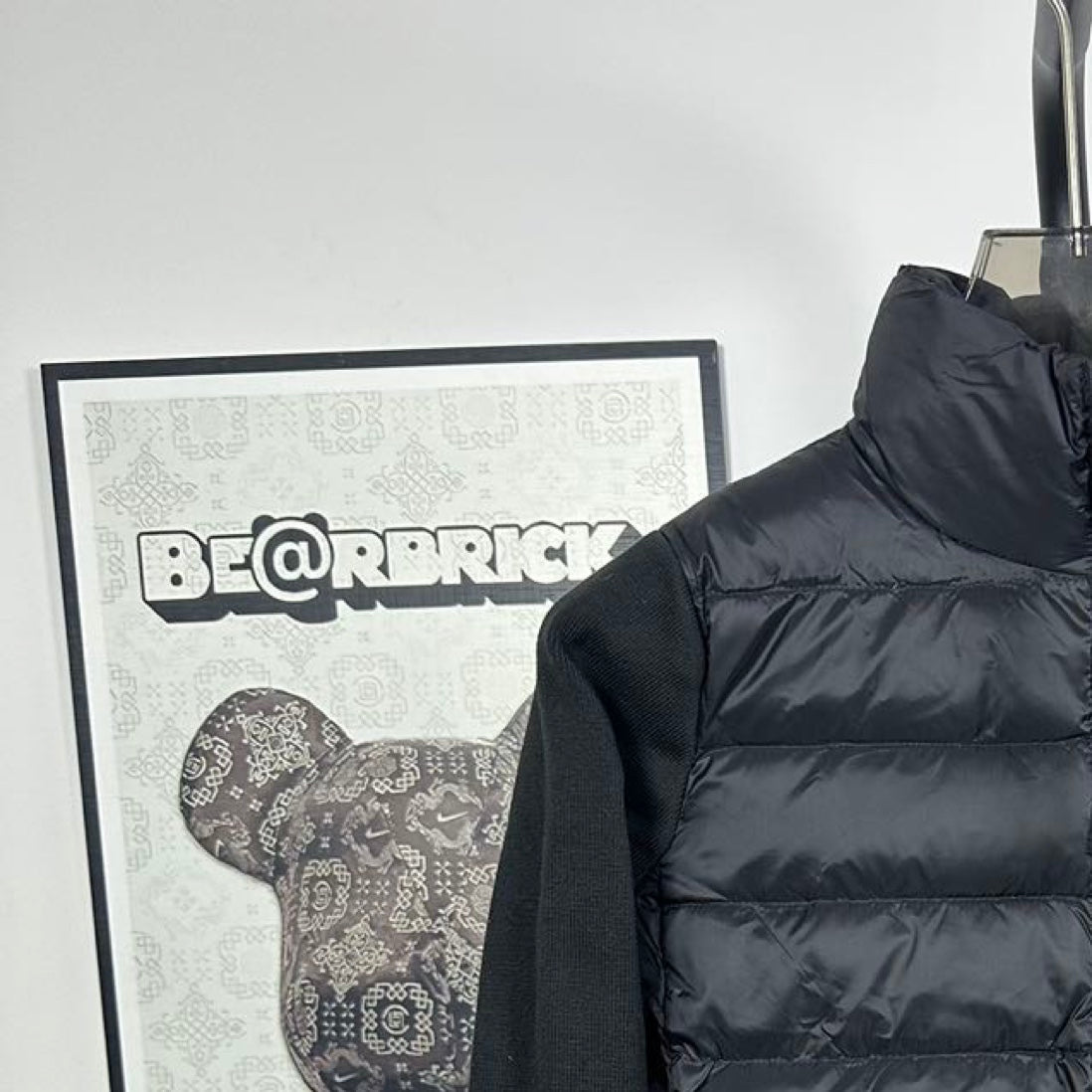 Moncler long puffer jacket front view with stand collar and full-zip closure