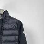 Moncler long puffer jacket side view with sleeve logo patch and quilted body
