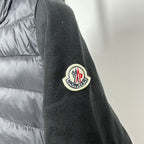 Moncler long puffer jacket sleeve patch logo on dark knit cuff