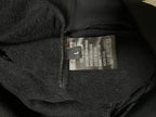 Dark hoodie inner neck label with care and material information