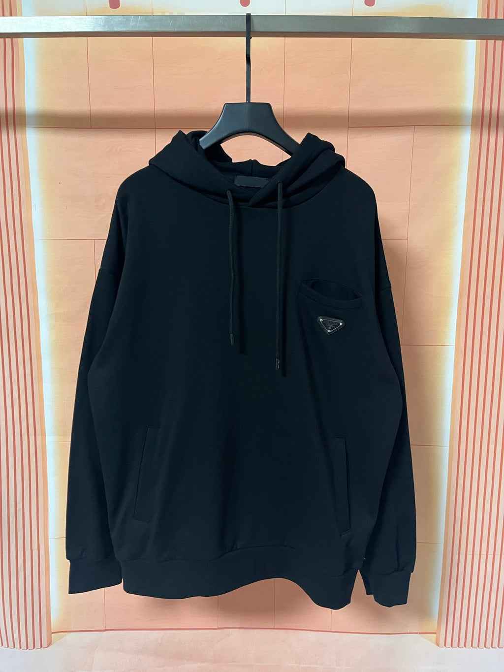 Prada dark hoodie with hood, drawstrings, and front kangaroo pocket