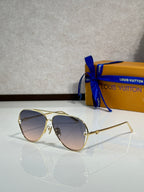 Louis Vuitton sunglasses with dark gradient tinted lenses and gold-tone metal frames