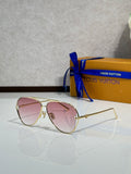Louis Vuitton sunglasses with pink tinted lenses and gold-tone metal frames