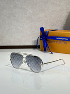 Louis Vuitton sunglasses with grey tinted lenses and grey monogram temples