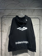 Black Balenciaga hoodie with front logo print and cowl neckline