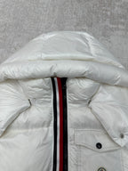 White puffer jacket close-up of hood and center-front zip