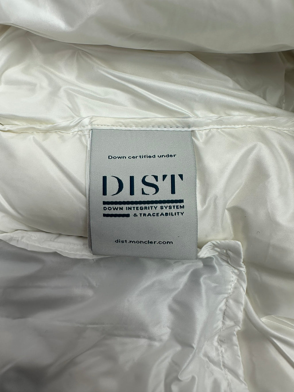 White puffer jacket fabric with DIST down certification label