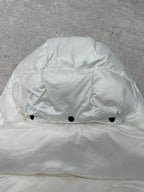 White puffer jacket hood with snap buttons at front opening