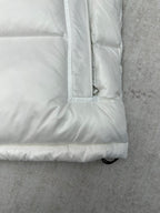 White puffer jacket sleeve cuff and padded hem with buttoned pocket