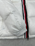 White puffer jacket sleeve with red-trim zipper and elastic cuff