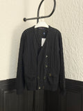Black knit cardigan with V-neck, button front, and flap pockets