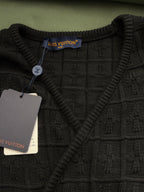 Black knit V-neck top with ribbed collar and Louis Vuitton neck label