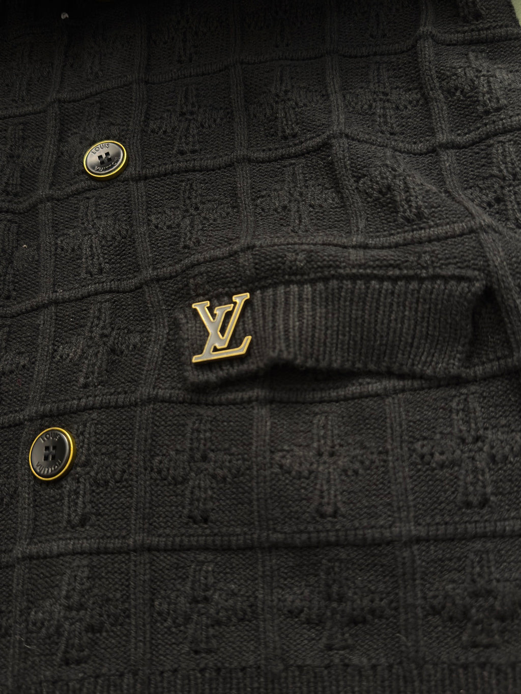 Black ribbed cardigan with small Louis Vuitton logo patch and gold buttons