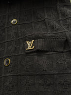 Black ribbed cardigan with small Louis Vuitton logo patch and gold buttons
