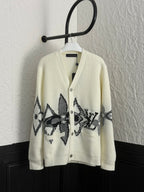 Louis Vuitton rib-knit cardigan in cream with black geometric star graphic panels