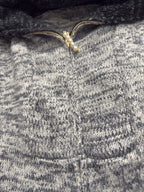 Louis Vuitton knit sweater close-up of front zip and textured stitch pattern