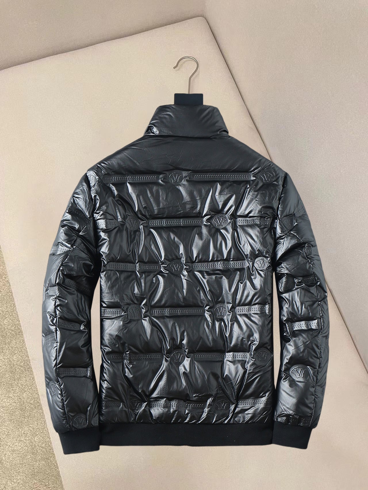 Back view of quilted padded jacket with stand collar and zipper detail