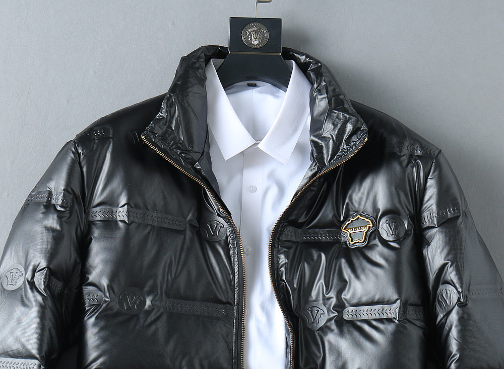 Padded jacket with stand collar, front zip, and logo-plaque zipper pull