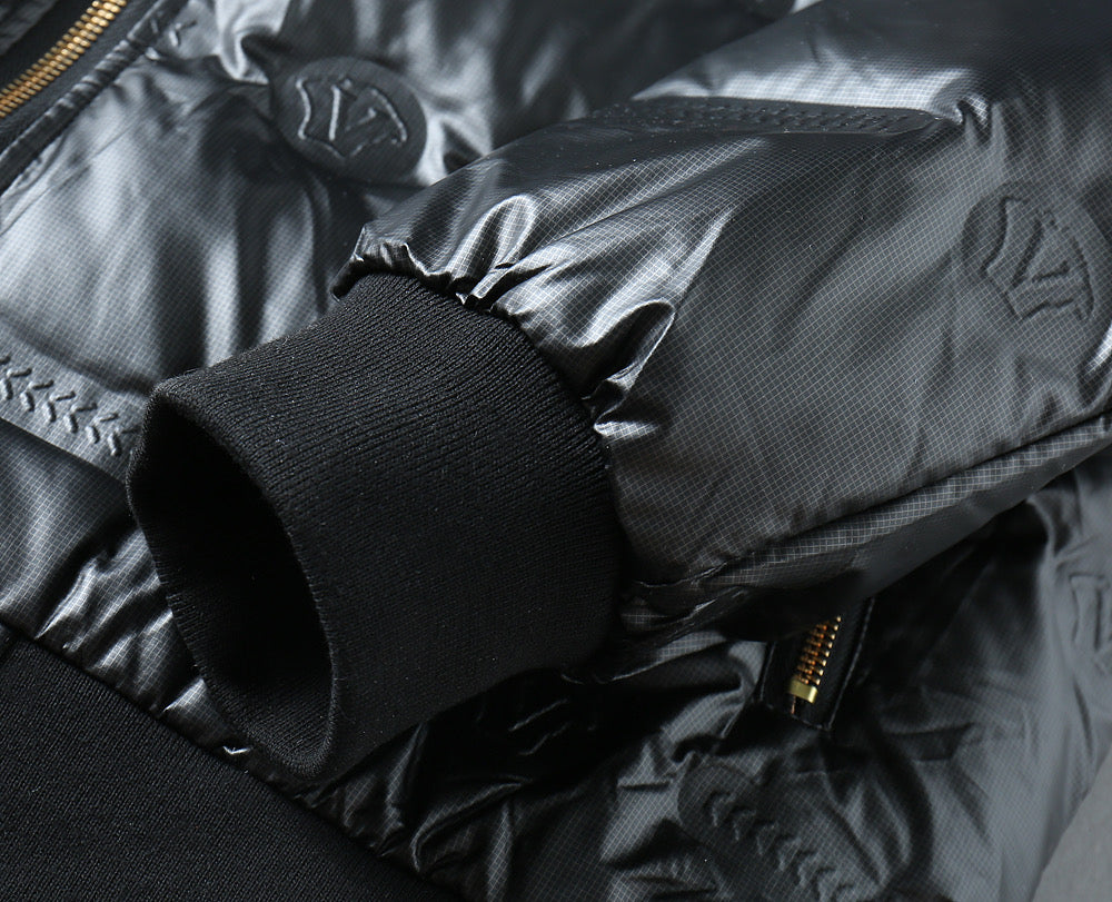 Padded jacket sleeve cuff and zipper edge with quilted embossed pattern