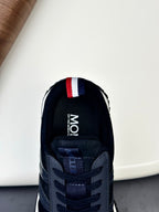 Moncler sneaker interior view with Moncler heel lining and lace opening