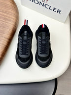 Moncler black sneakers with gray panels and red-white-blue heel stripe