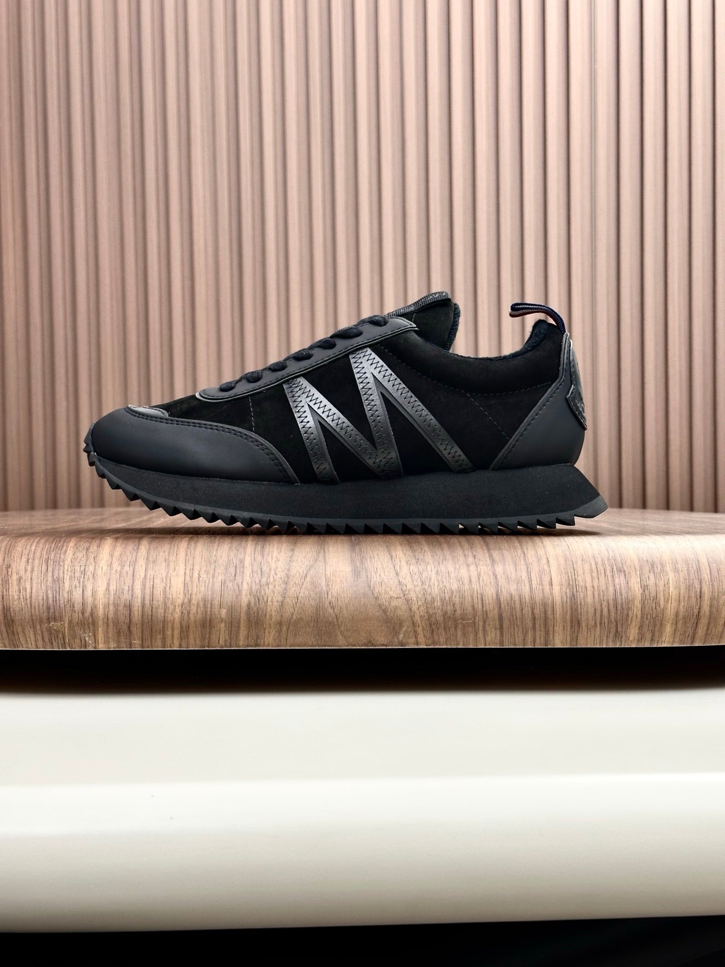 Moncler black low-top sneakers with textured tread and lace-up front