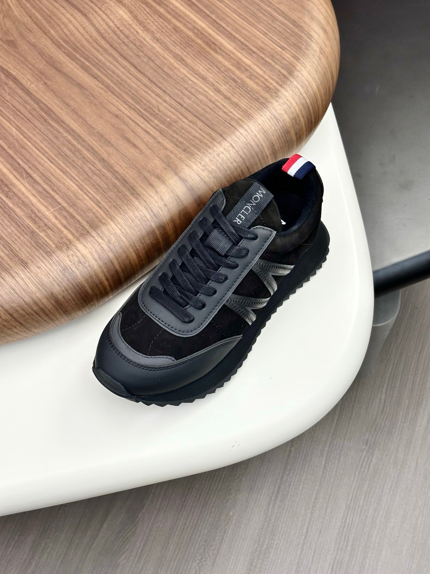 Moncler black low-top sneakers with red-white-blue heel tab