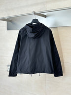 Prada long hooded puffer jacket, black, back view with drawstring hem