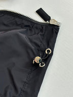 Prada jacket waist detail with zipper tab and snap-ring hardware