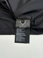 Long black garment with size 46 label, Prada Re-Nylon