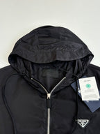 Prada hooded puffer jacket, black, close-up of hood and front zipper