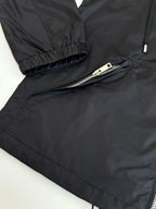 Black puffer jacket sleeve cuff and zipper detail