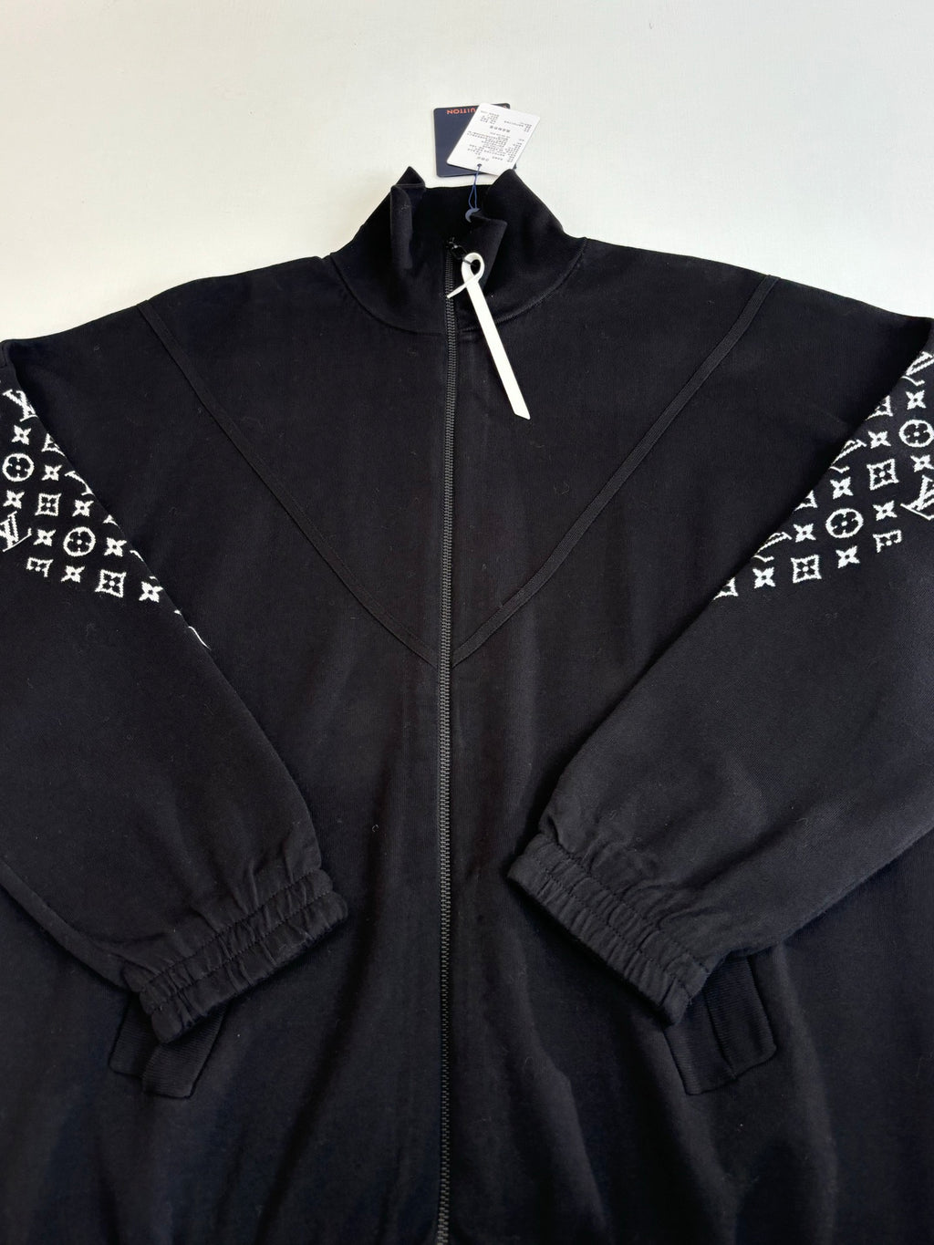 Louis Vuitton zip-up jacket detail, dark navy, full front zipper and seams