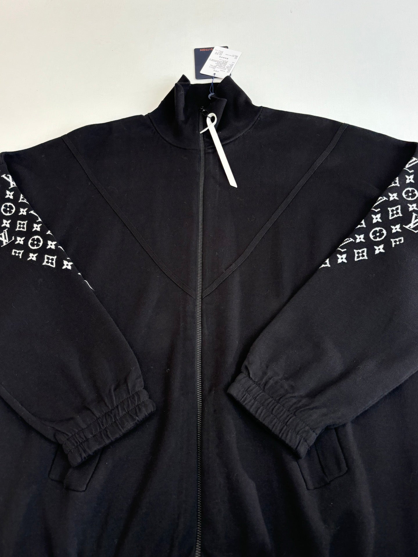 Louis Vuitton zip-up jacket detail, dark navy, full front zipper and seams