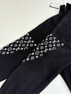 Dark navy logo-print sleeve, Louis Vuitton monogram pattern, jacket detail