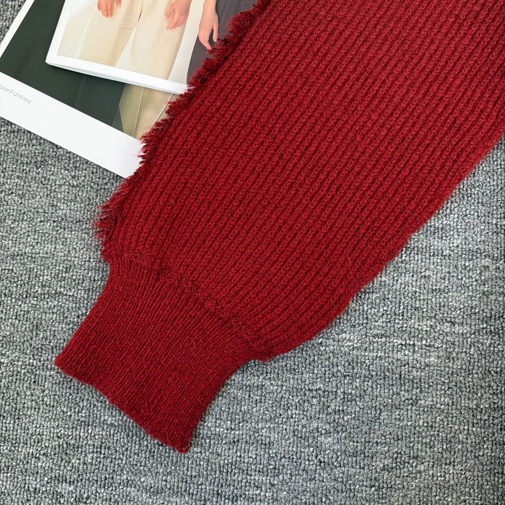 Burgundy ribbed knit sleeve cuff with soft frayed trim