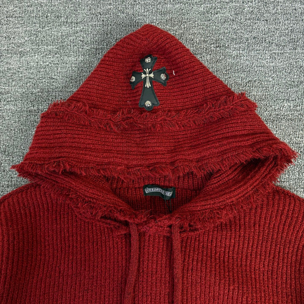 Burgundy ribbed knit hoodie with fringe-edged hood and cross appliqué detail