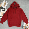Burgundy long-sleeve knit hoodie with hood, drawstring, and front kangaroo pocket