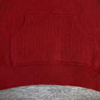 Burgundy knit hoodie with ribbed kangaroo pocket and drawstring opening
