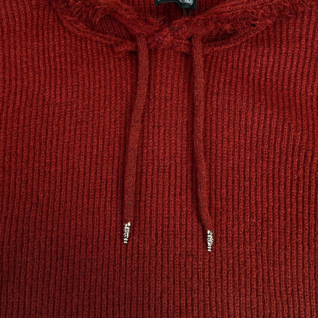 Burgundy knit hoodie close-up with drawstrings and ribbed hood front