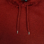 Burgundy knit hoodie close-up with drawstrings and ribbed hood front