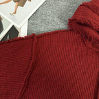 Burgundy knit hoodie close-up of shoulder and textured ribbed fabric