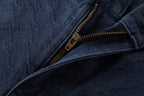 Navy jeans pocket with gold-tone zipper and jacquard fabric texture